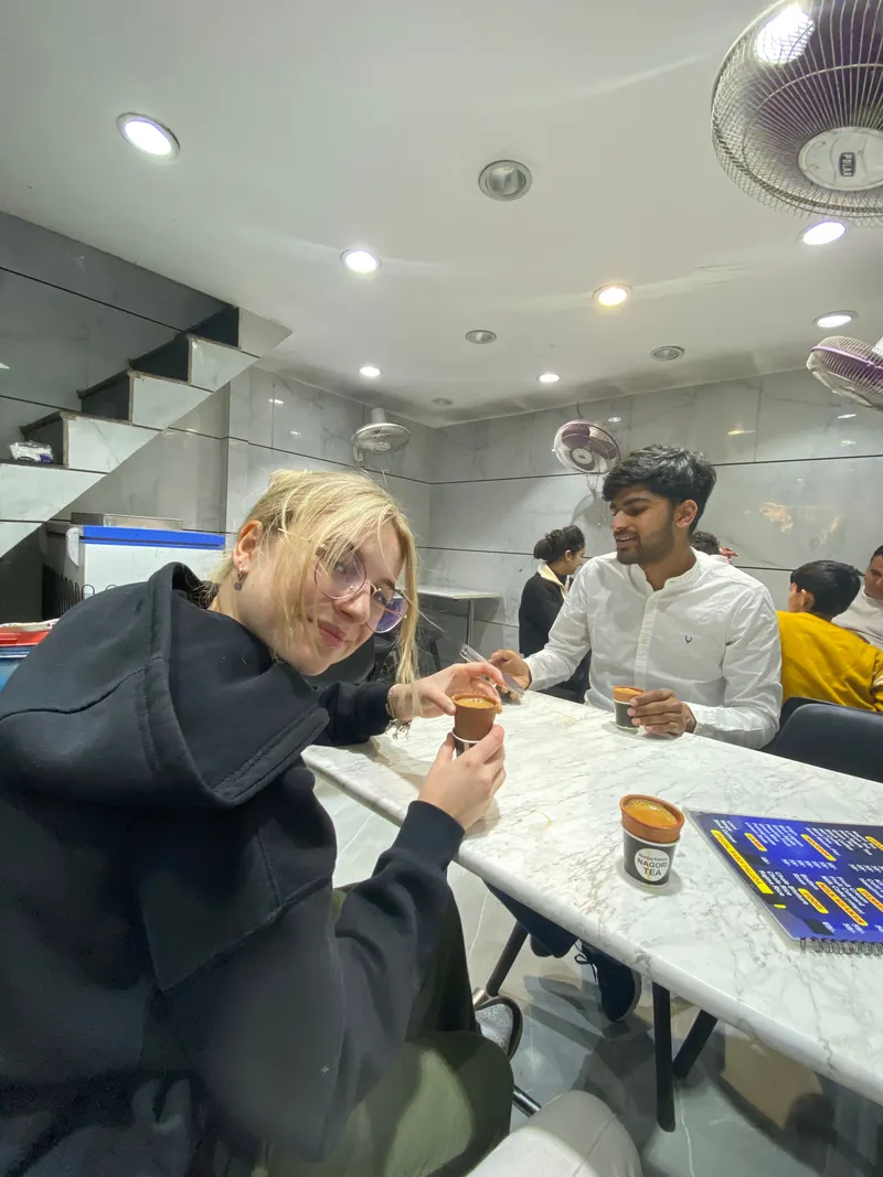 Drinking chai with our guide in New Delhi