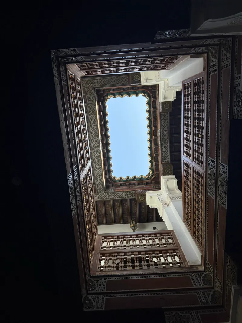 Light coming through the carved roof of one of Madrassa Ben Youssef's side courtyards, where the classrooms used to be