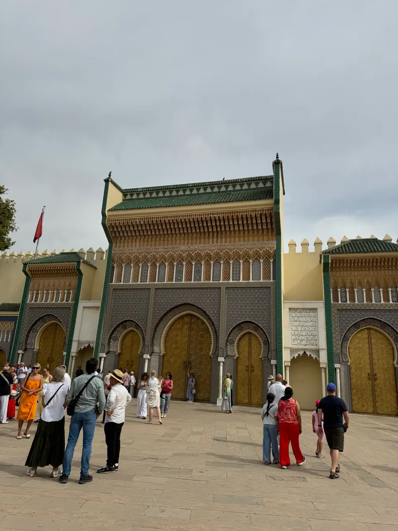 Visitors gathering for photos in front of the Royal Palace gates, Fes